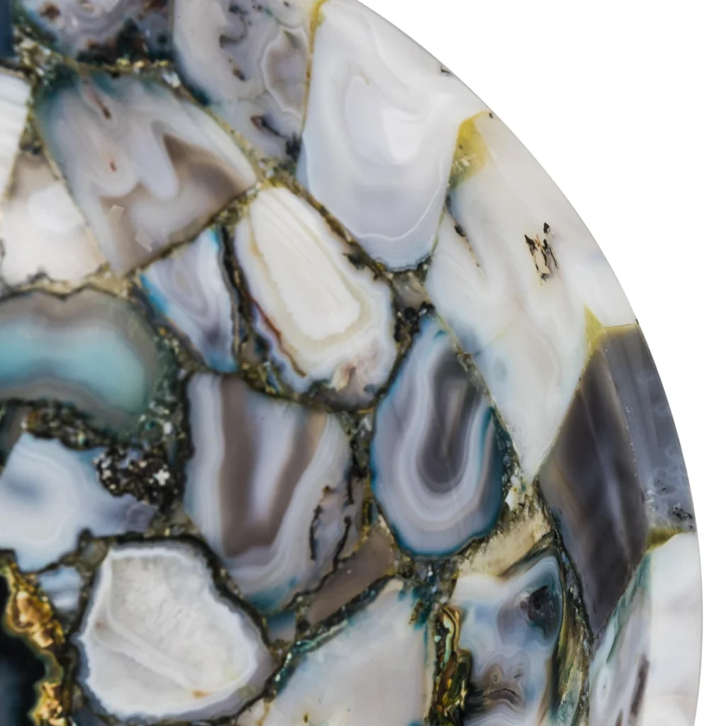 Introduce elegance into your bathroom with our handcrafted agate stone wash basin. Each piece is meticulously crafted from natural agate stone, showcasing unique patterns that bring a stunning touch of nature to your home. This basin is not just a functional piece but also an exquisite decor element, elevating the ambiance of any bathroom or powder room. Its sleek, modern design combined with the timeless beauty of agate makes it a centerpiece for luxury spaces.