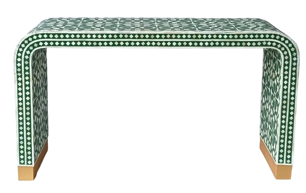 Bring a touch of elegance and craftsmanship to your living space with this exquisite Bone Inlay Console Table. Handcrafted by skilled artisans, this piece features intricate hand-carved bone details and curvaceous corners that create a sophisticated and timeless design. The console is made from solid wood and MDF for durability and longevity. Its base is accentuated with a brass cladding, offering a luxurious touch while enhancing the overall aesthetics. With its sleek and modern form, this console table is perfect for your entryway, living room, or hallway, adding both beauty and functionality to any space