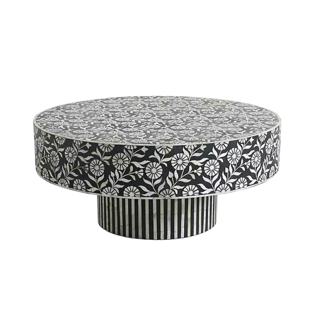 Elevate your living space with this stunning bone inlay coffee table, meticulously handcrafted by skilled artisans. Featuring a beautiful black and white floral pattern with a striking striped pedestal base, this unique piece is both functional and artistic. Made from tropical hardwood with intricate bone and resin inlay, this coffee table is sealed with a clear lacquer, ensuring durability and longevity. Its 36-inch diameter and elegant design make it a perfect centerpiece for any living room, offering a luxurious touch to both modern and traditional interiors.
