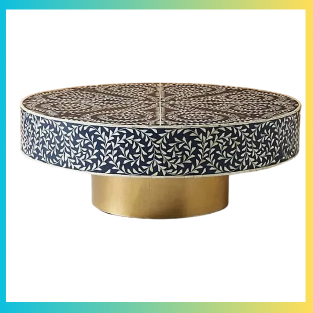 Add a touch of elegance and artistry to your living spaces with this Handmade Bone Inlay Round Coffee Table, crafted with precision by skilled artisans. This stunning piece combines intricate floral bone inlay patterns with a smooth brass base, creating a luxurious and eye-catching centerpiece. Its large round design provides ample space for serving or decorating, making it perfect for entertaining or showcasing your favorite items. Made from high-quality wood, resin, bone, and metal, this table not only stands out as a statement piece but also adds a refined charm to any modern or traditional décor.