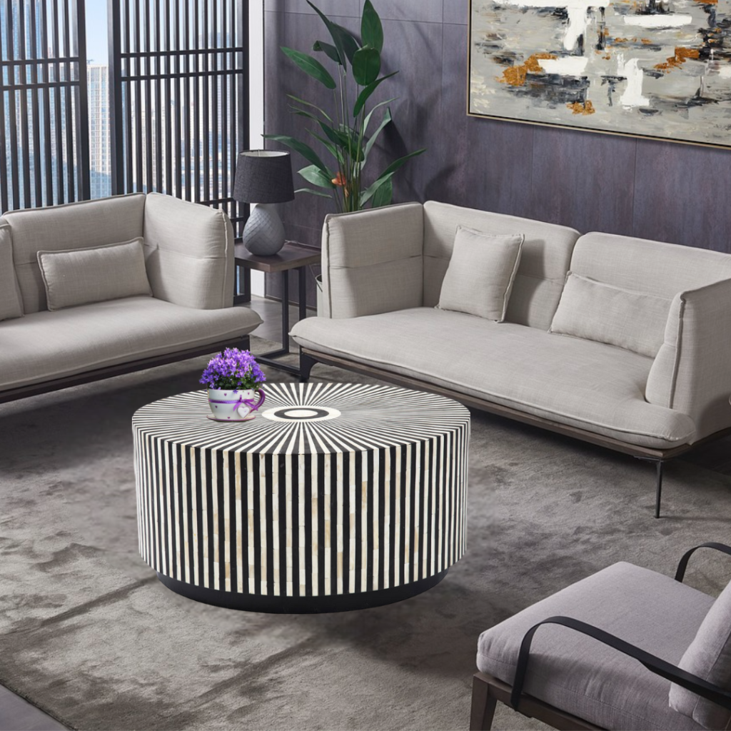Bring sophistication and artistic flair to your living room with this striking Black and White Buffalo Bone Inlay Coffee Table. Meticulously handcrafted by artisans, this table combines traditional craftsmanship with a bold, contemporary design. The intricate black and white striped pattern, crafted from natural buffalo bone and resin inlay, radiates from the center, creating a mesmerizing optical effect that draws the eye. Made with solid wood and MDF, this round coffee table is both sturdy and stylish, making it a functional work of art for your home.
