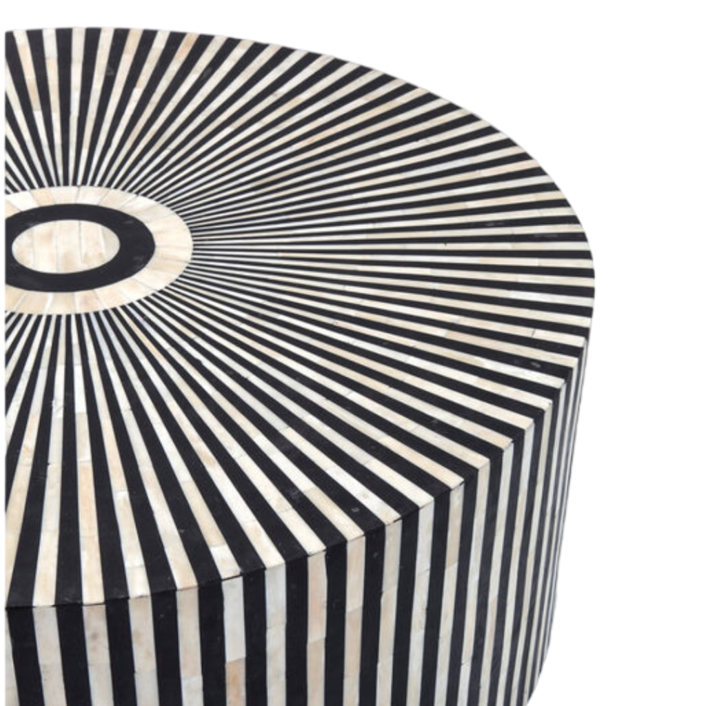 Bring sophistication and artistic flair to your living room with this striking Black and White Buffalo Bone Inlay Coffee Table. Meticulously handcrafted by artisans, this table combines traditional craftsmanship with a bold, contemporary design. The intricate black and white striped pattern, crafted from natural buffalo bone and resin inlay, radiates from the center, creating a mesmerizing optical effect that draws the eye. Made with solid wood and MDF, this round coffee table is both sturdy and stylish, making it a functional work of art for your home.